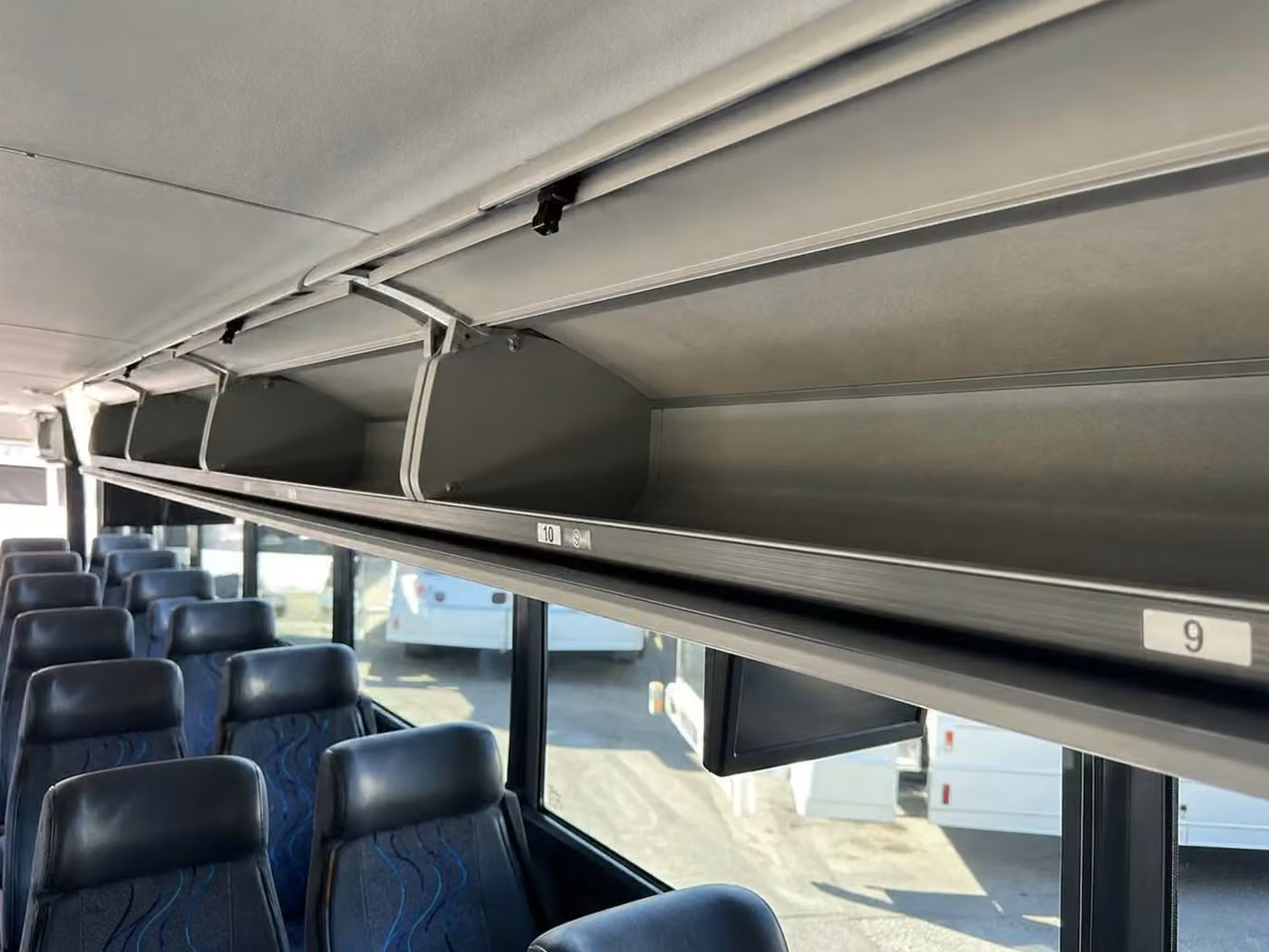 bell gardens 56 passenger charter bus overhead storage
